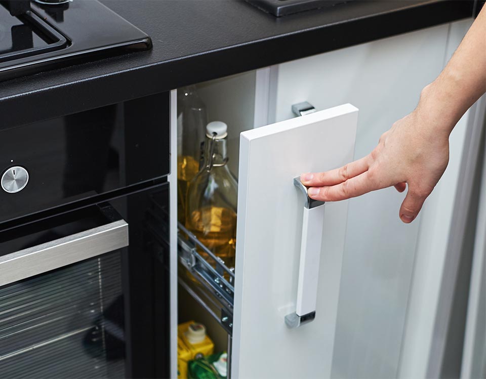 Thin kitchen drawer for storing bottles and cartons
