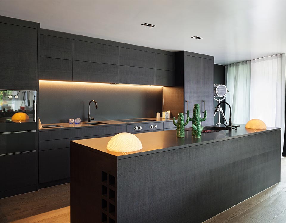 Dark kitchen cabinets and benchtops